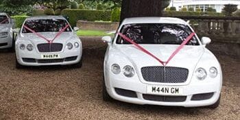 Twin bentley continental flying spur for prestige wedding car hire birmingham